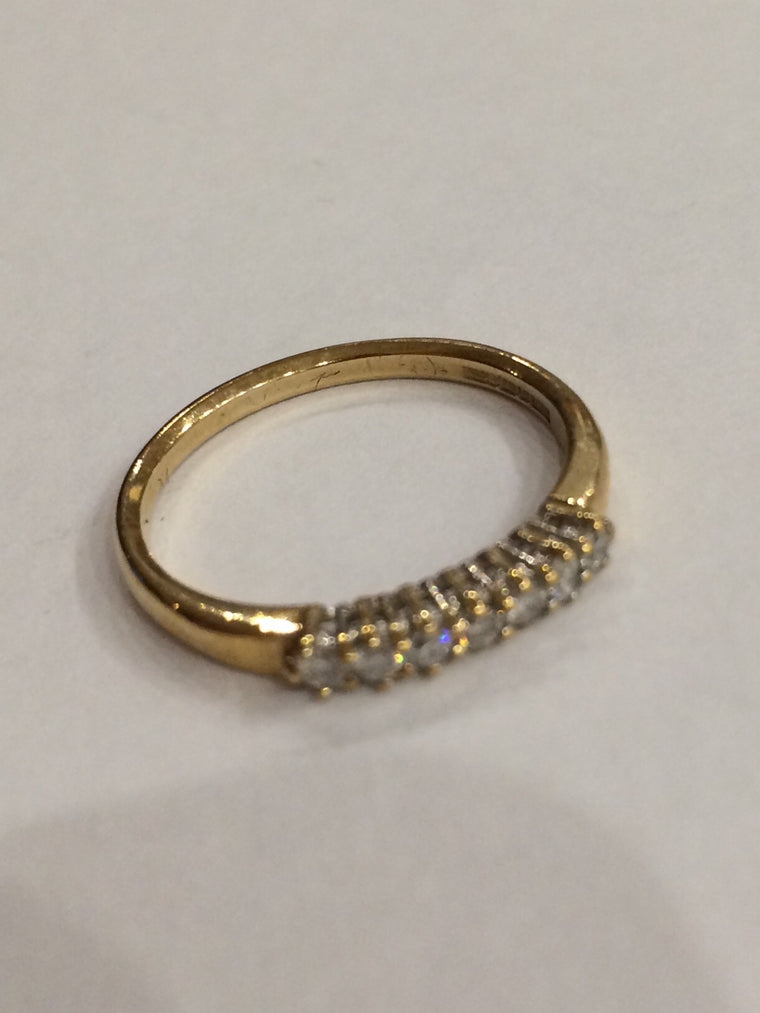 9CT YELLOW GOLD 0.10CTS CLAW SET ETERNITY RING